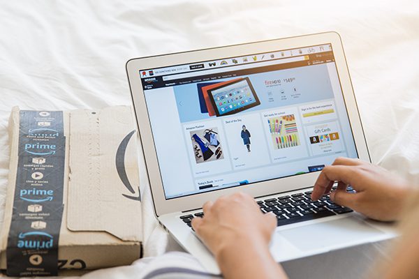 Open laptop with Amazon on screen.